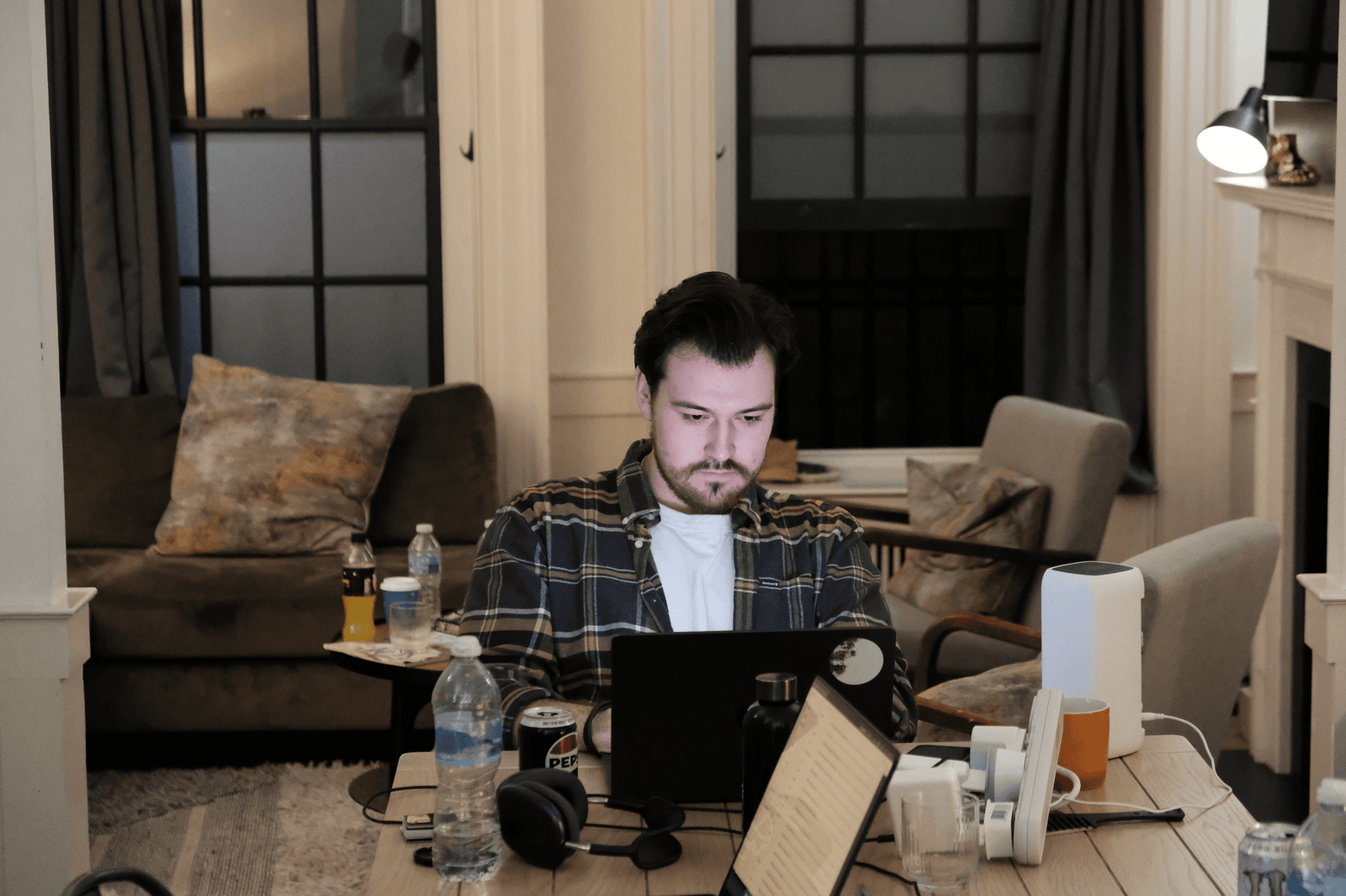 A Scape teammate working at a shared table.